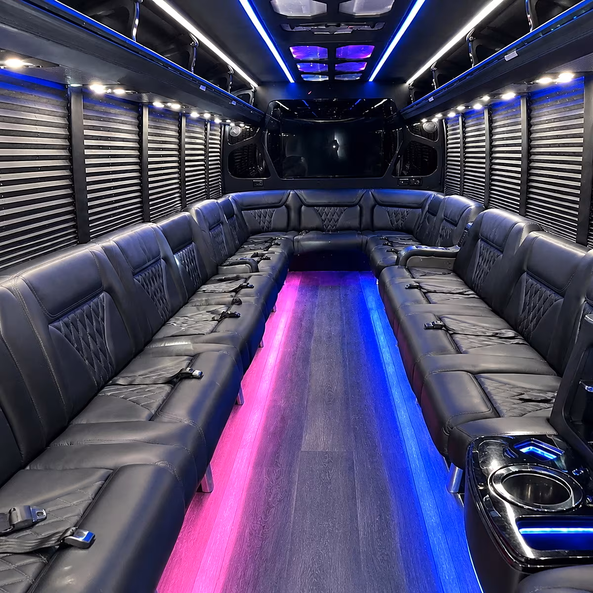 Friends laughing during a party bus celebration in Detroit